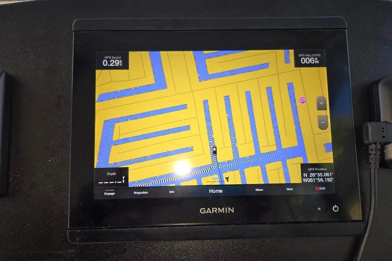 Slide: The Image of Garmin GPS display on 2009 Mainship Pilot 31, showing navigation map and coordinates. - 43