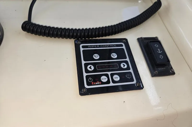 Slide: The Image of Wiper control panel on 2009 Mainship Pilot 31 boat dashboard. - 45