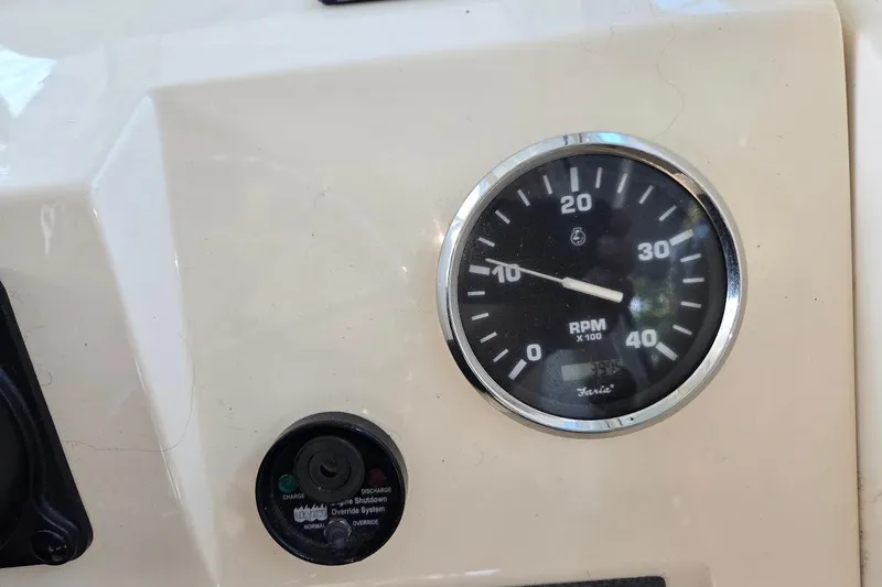 Slide: The Image of RPM gauge and control panel on 2009 Mainship Pilot 31 boat. - 49