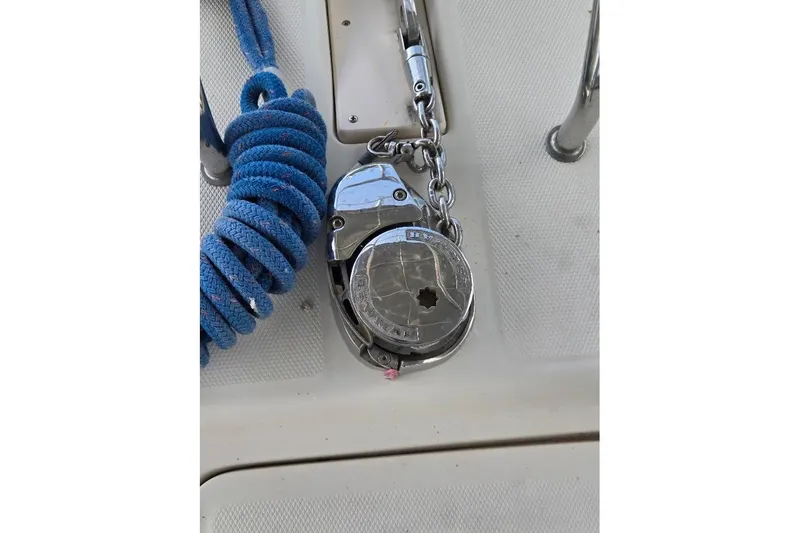 Slide: The Image of 2009 Mainship Pilot 31 deck with coiled blue rope and anchor chain. - 57