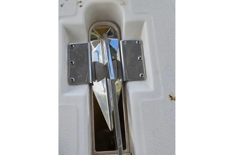 Slide: The Image of Anchor holder on 2009 Mainship Pilot 31 boat, featuring stainless steel fittings. - 60