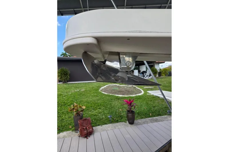Slide: The Image of 2009 Mainship Pilot 31 boat anchor detail with garden background. - 61