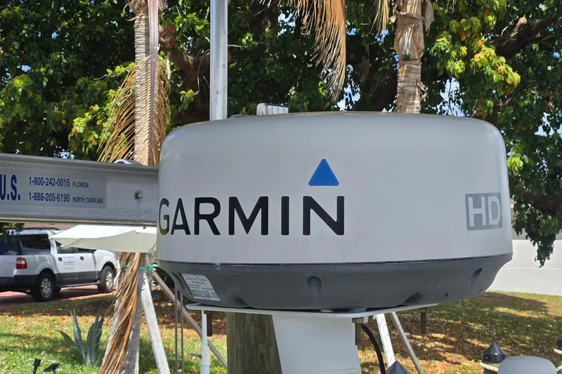 Slide: The Image of Garmin HD radar on 2009 Mainship Pilot 31 boat, outdoor setting with trees. - 64