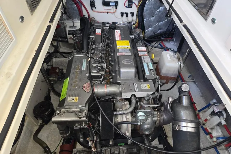 Slide: The Image of Engine compartment of a 2009 Mainship Pilot 31 boat, featuring a Yanmar engine. - 67