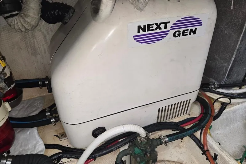 Slide: The Image of Engine compartment of a 2009 Mainship Pilot 31 with Next Gen generator. - 73