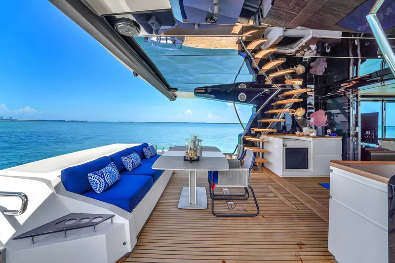 Slide: The Image of Luxurious 2021 OKEAN 80 yacht interior with ocean view, featuring elegant seating and modern design. - 13