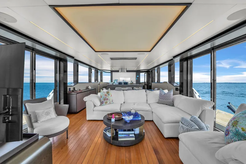 Slide: The Image of Luxurious interior of 2021 OKEAN 80 yacht with ocean view, featuring elegant white seating. - 15
