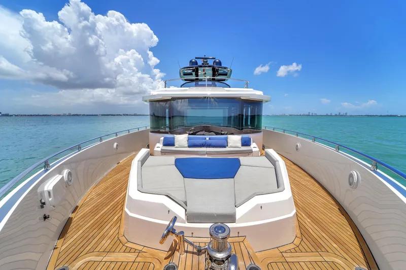 Slide: The Image of Luxurious 2021 OKEAN 80 yacht deck with seating, ocean view, and clear blue sky. - 24