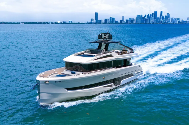 Slide: The Image of Luxury OKEAN 80 yacht cruising near city skyline, 2021 model. - 3