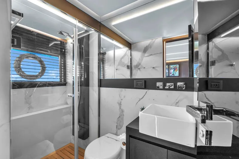 Slide: The Image of Luxurious bathroom in 2021 OKEAN 80 yacht with modern fixtures and marble accents. - 40