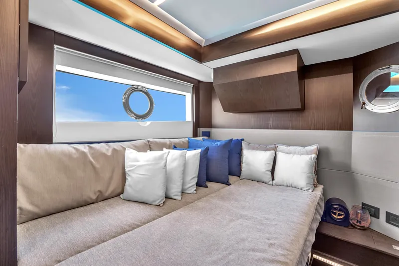 Slide: The Image of Luxurious interior of 2021 OKEAN 80 yacht with plush seating and porthole views. - 43