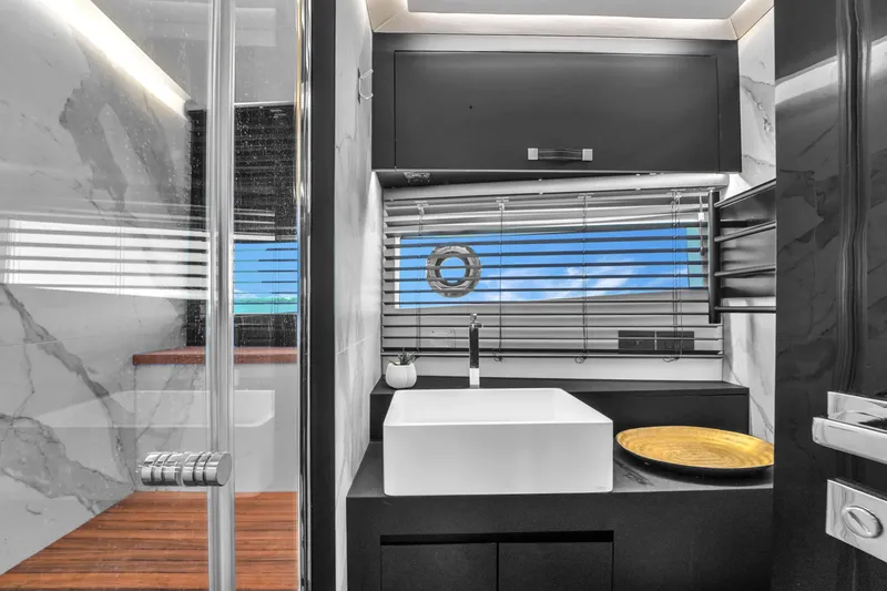 Slide: The Image of Modern bathroom on 2021 OKEAN 80 yacht with sleek design and ocean view. - 46