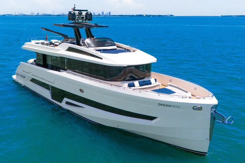 Slide: The Image of Luxury 2021 OKEAN 80 yacht on clear blue ocean waters. - 7