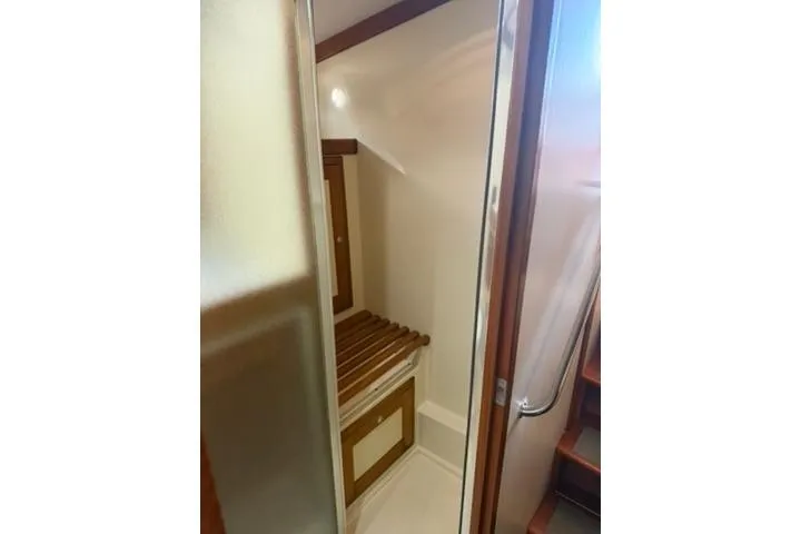 Slide: The Image of 2001 Nordhavn 40 yacht interior with wooden accents and compact design. - 15