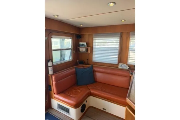 Slide: The Image of Cozy interior of 2001 Nordhavn 40 yacht with leather seating and windows. - 5