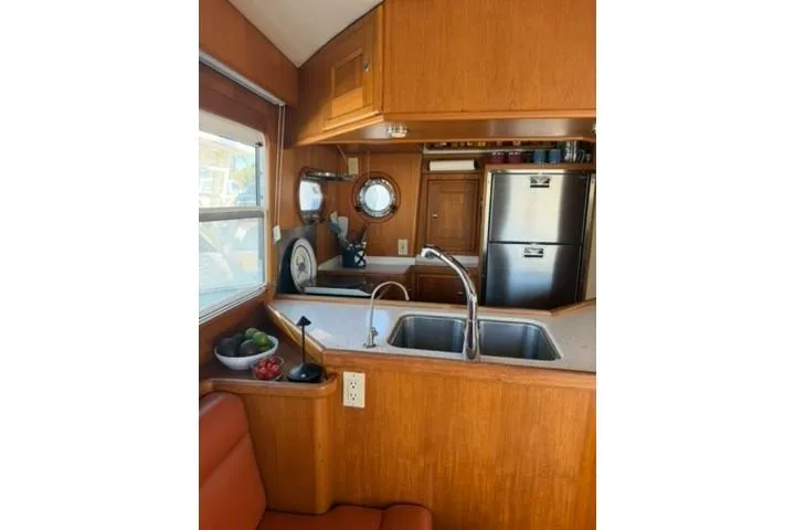 Slide: The Image of Interior of 2001 Nordhavn 40 yacht with kitchen and seating area. - 7