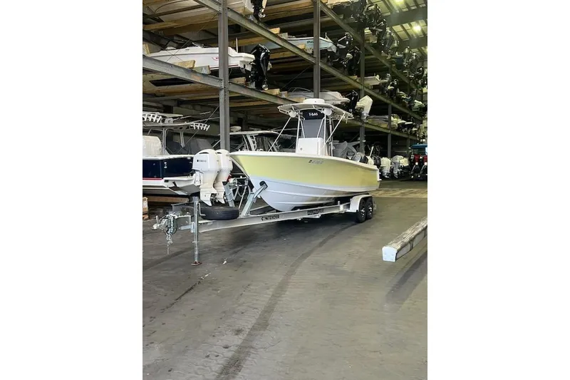Slide: The Image of 2012 Contender 25 Tournament boat on trailer in storage facility. - 12