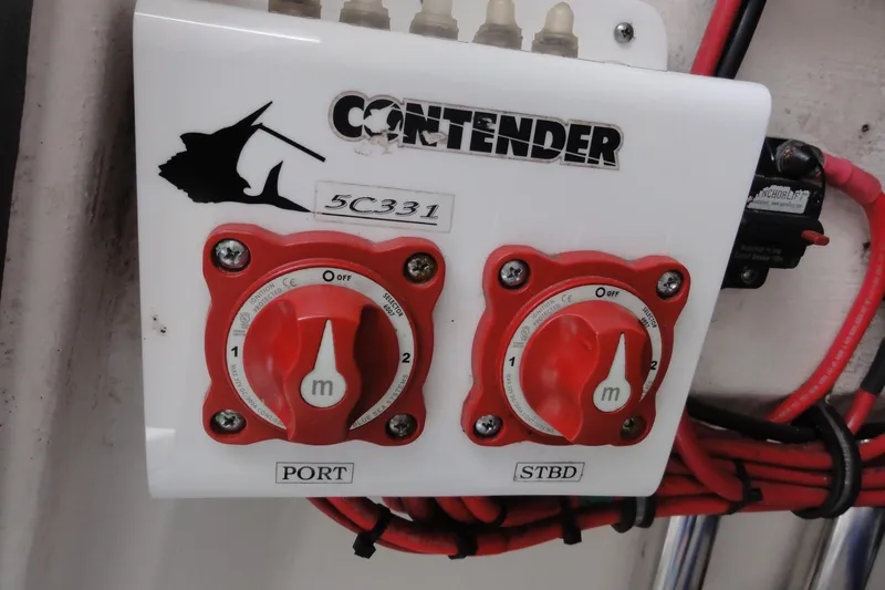 Slide: The Image of Battery switches on a 2012 Contender 25 Tournament boat, labeled "PORT" and "STBD." - 19