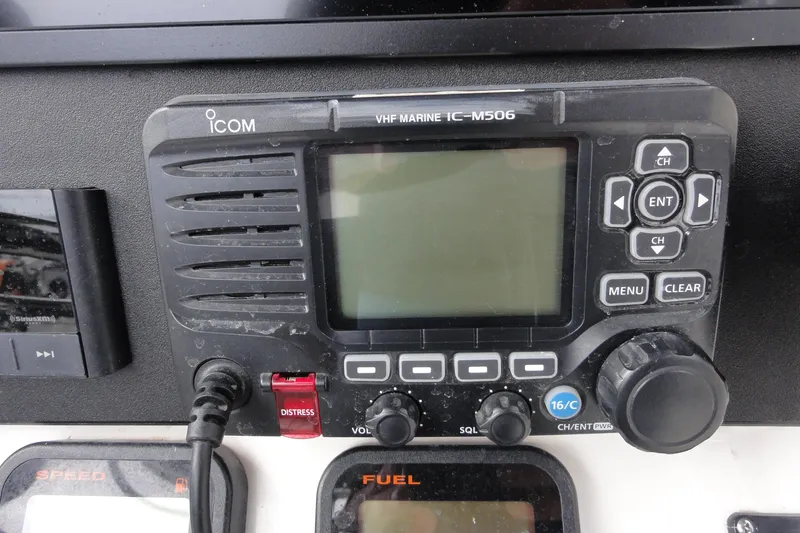 Slide: The Image of Icom VHF Marine IC-M506 radio on 2012 Contender 25 Tournament boat dashboard. - 24