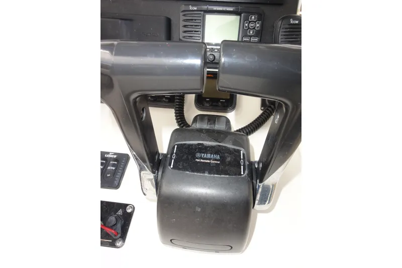 Slide: The Image of Control panel of a 2012 Contender 25 Tournament boat with Yamaha remote control. - 26