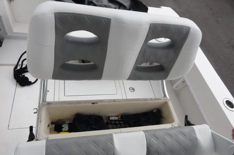 Slide: The Image of 2012 Contender 25 Tournament boat seat with storage compartment open. - 31