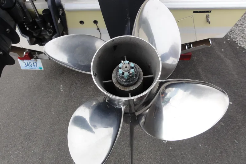 Slide: The Image of Close-up of a Contender 25 Tournament 2012 boat propeller on pavement. - 34