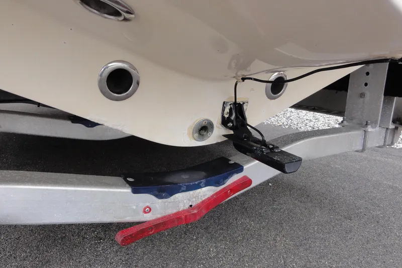 Slide: The Image of 2012 Contender 25 Tournament boat on trailer, showing hull and transom details. - 35