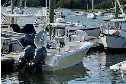 Slide: The Image of 2012 Contender 25 Tournament boat docked with twin engines in a marina. - 9