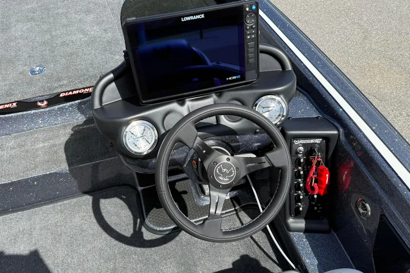 Slide: The Image of Steering console of 2025 Phoenix 819 ZXL boat with Lowrance HDS12 display. - 15