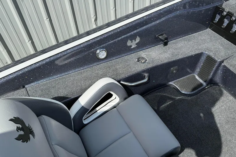 Slide: The Image of Interior of 2025 Phoenix 819 ZXL boat with sleek seating and textured flooring. - 16