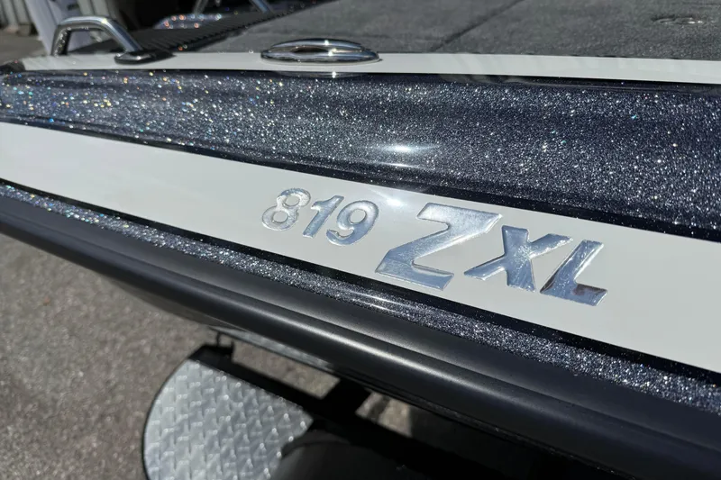 Slide: The Image of 2025 Phoenix 819 ZXL boat with metallic finish and model emblem. - 3