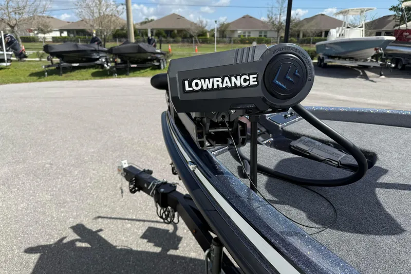 Slide: The Image of ```html Alt text: "2025 Phoenix 819 ZXL boat with Lowrance equipment in a parking area." ``` - 9