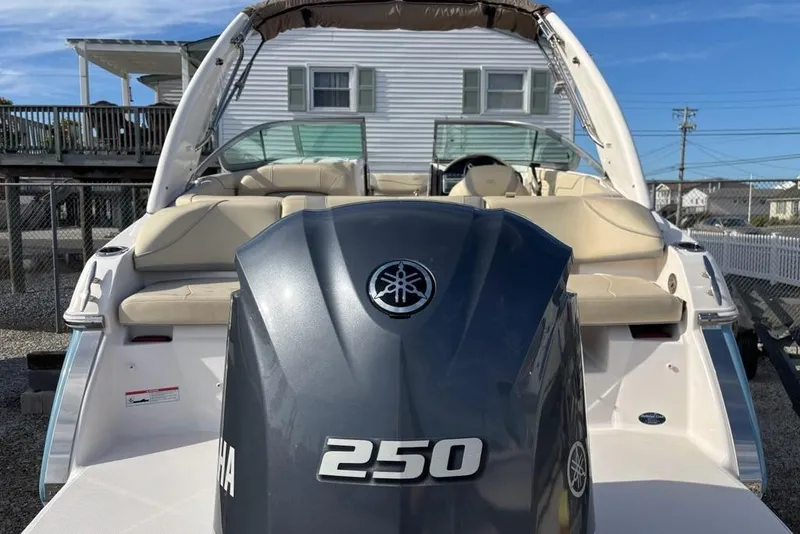 Slide: The Image of 2021 Regal 23 OBX boat with Yamaha 250 outboard motor, beige seating, and sleek design. - 10