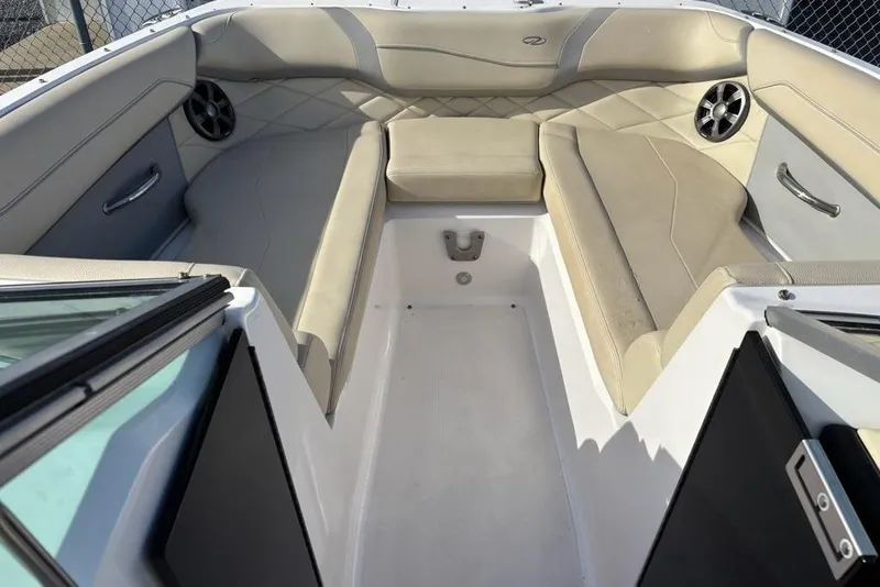 Slide: The Image of Interior of 2021 Regal 23 OBX boat with beige seating and speakers. - 12