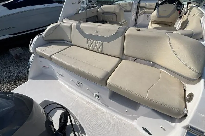 Slide: The Image of 2021 Regal 23 OBX boat interior with beige seating and modern design. - 19