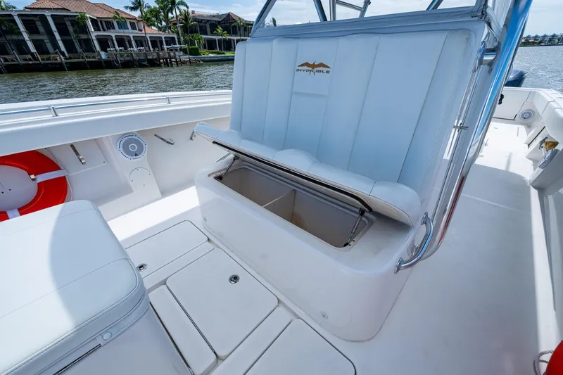Slide: The Image of 2015 Invincible 42 Open Fisherman boat interior with storage compartment open. - 25