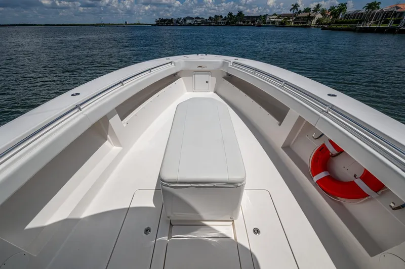 Slide: The Image of 2015 Invincible 42 Open Fisherman boat deck with seating and life preserver. - 27