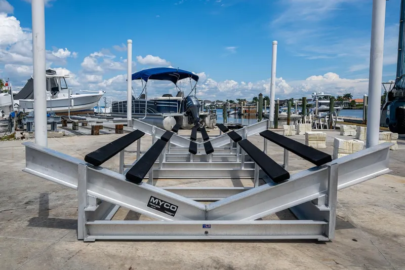 Slide: The Image of Boat lift at marina with Invincible 42 Open Fisherman, 2015 model, under clear blue sky. - 33
