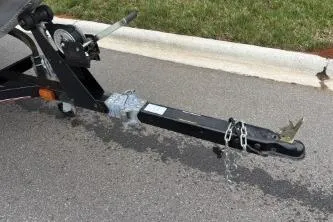Slide: The Image of Trailer hitch of a 2002 Tracker Pro Team 165 boat on pavement. - 20