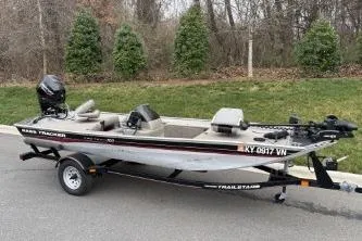 Slide: The Image of 2002 Tracker Pro Team 165 fishing boat on trailer, parked on roadside. - 4