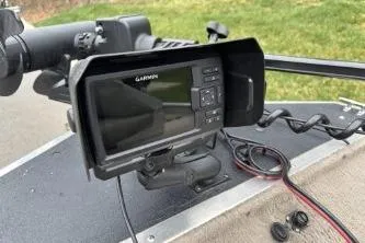 Slide: The Image of Garmin fish finder on 2002 Tracker Pro Team 165 boat dashboard. - 5