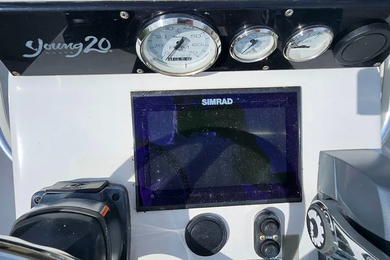 Slide: The Image of Dashboard of 2007 Young Boats 20 Bay with Simrad display and gauges. - 10