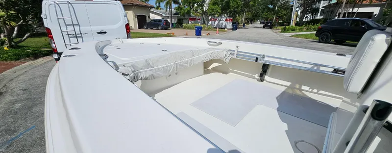 Slide: The Image of 2007 Young Boats 20 Bay interior view, parked on a residential street. - 6