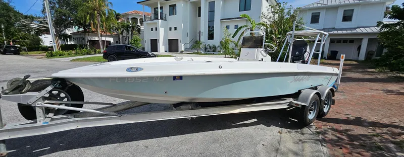 Slide: The Image of 2007 Young Boats 20 Bay on trailer in residential driveway. - 7