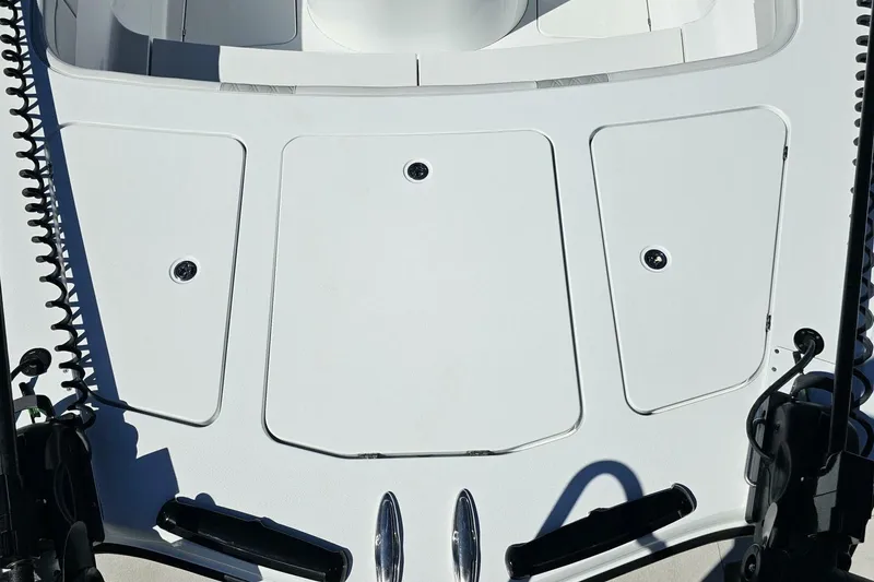 Slide: The Image of 2025 Costa Custom Boats 34ST deck with storage compartments and sleek design. - 12