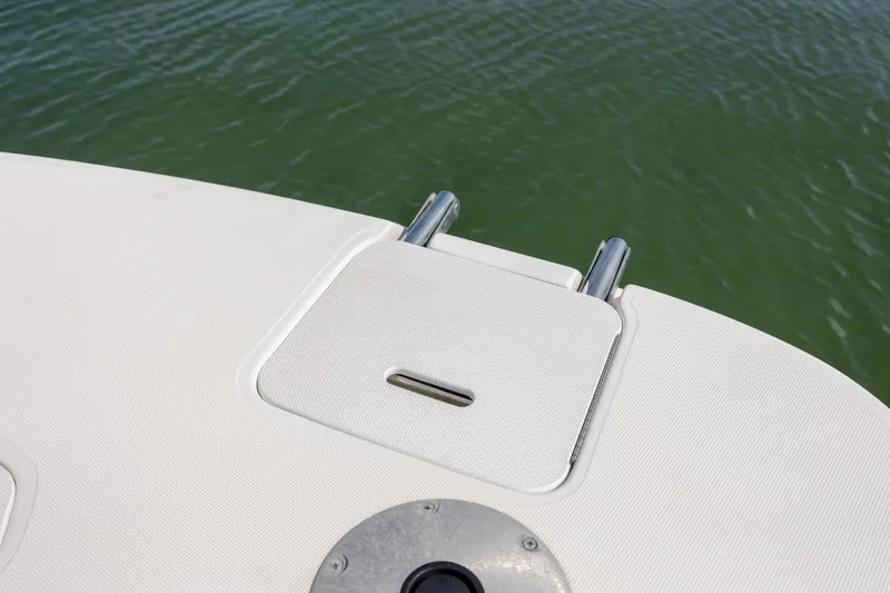 Slide: The Image of 2019 Hurricane SunDeck Sport 201 OB boat deck with ladder, on calm water. - 18