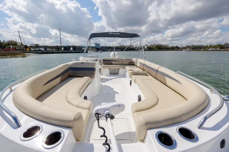 Slide: The Image of 2019 Hurricane SunDeck Sport 201 OB boat with spacious seating on a sunny day. - 19