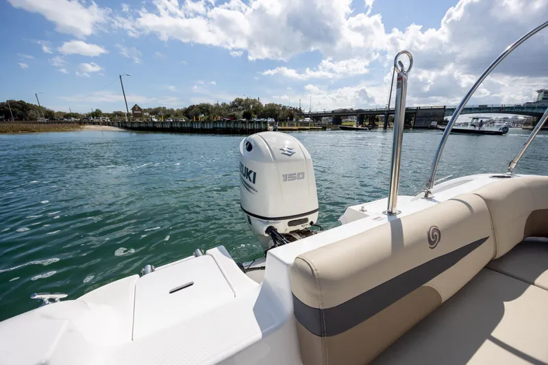 Slide: The Image of 2019 Hurricane SunDeck Sport 201 OB boat with Suzuki 150 engine on a sunny day. - 23