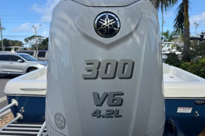 Slide: The Image of 2025 Skeeter SX2350 boat with Yamaha 300 V6 4.2L engine in a marina setting. - 10
