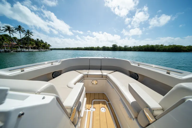 Slide: The Image of 2018 Boston Whaler 320 Vantage boat interior with spacious seating, scenic water view. - 41